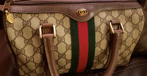 how to tell a genuine gucci purse